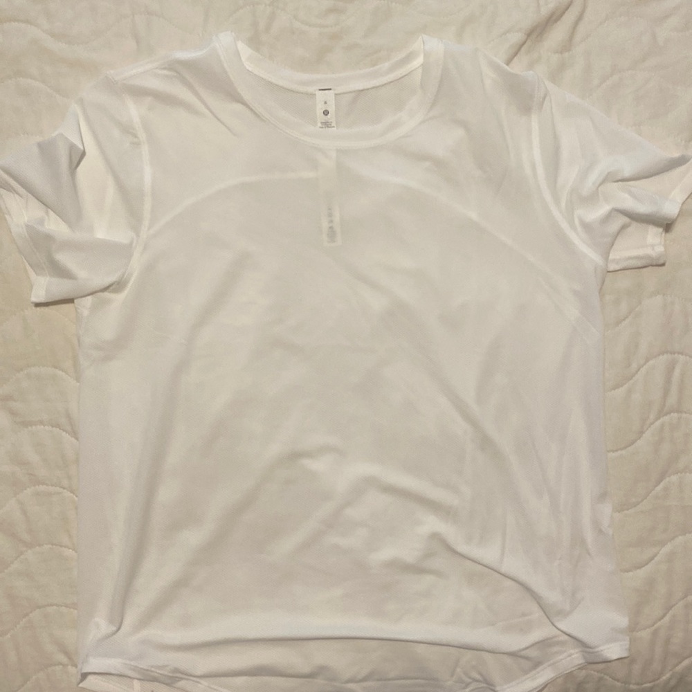 Never worn white lululemon shirt with tag